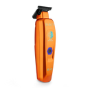 An orange cordless hair clipper with a black blade and a blue power button, shown on a solid white background. The clipper features the brand name 'SABER' and a logo for 'Hairline Pro' printed on its surface.